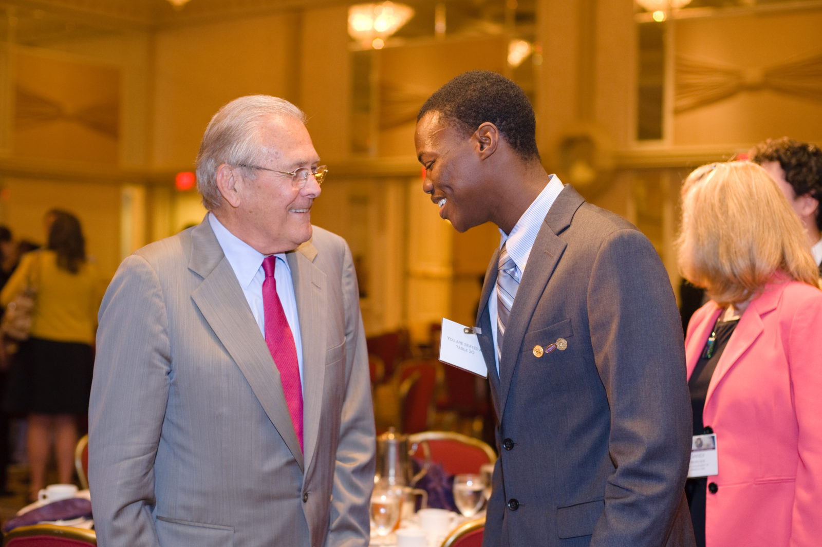 ICPES student Housseine M. Heimid (r.) meets former Defense Secretary Donald Rumsfeld during the annual TFAS Judd Award luncheon.