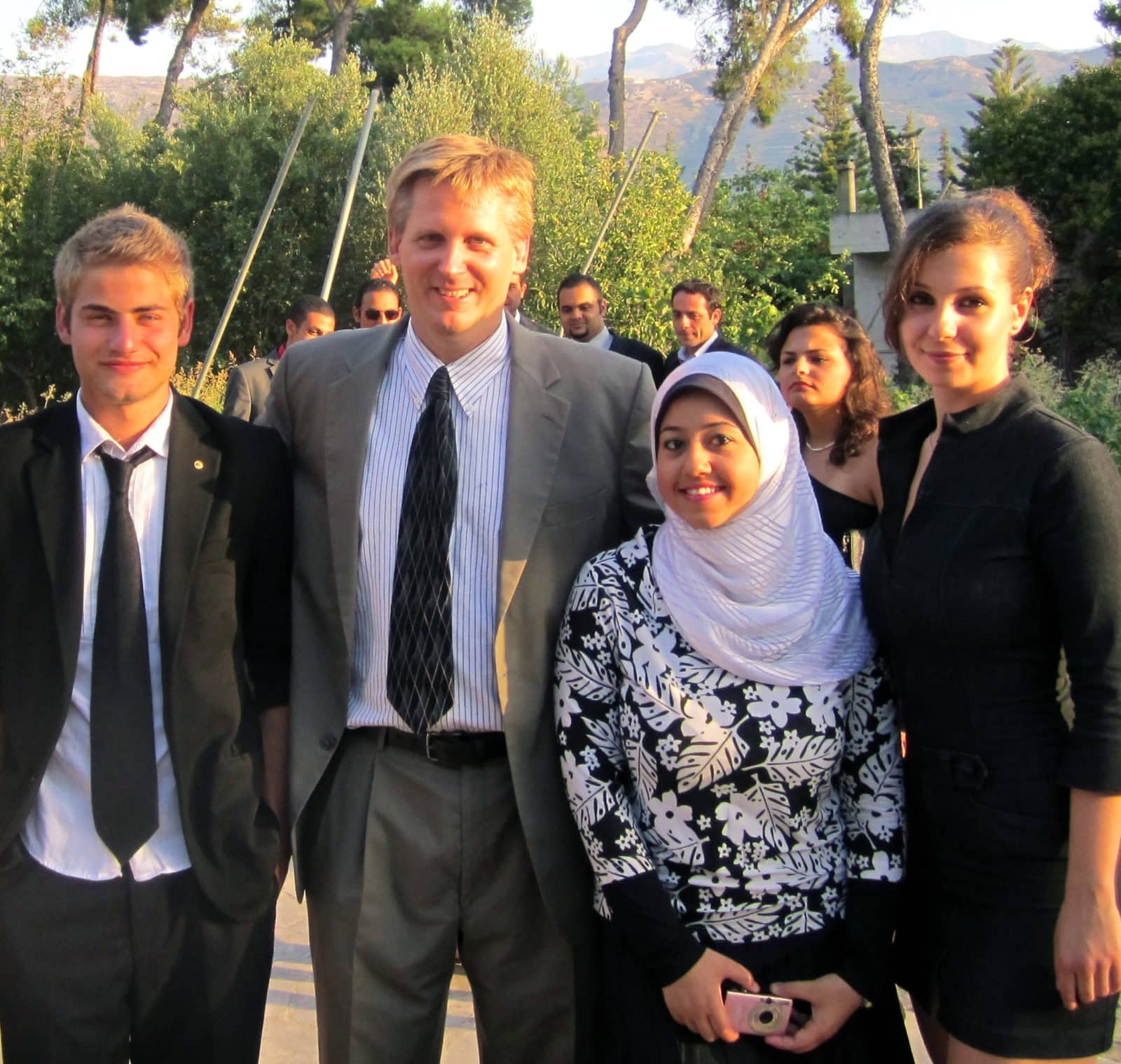 (l.-r.) Besart Zhuja (Kosovo), European institutes program director Matt Kwasiborski, Dina Mansour (Egypt) and Mila Nikolova (Bulgaria) enjoy the commencement celebration.