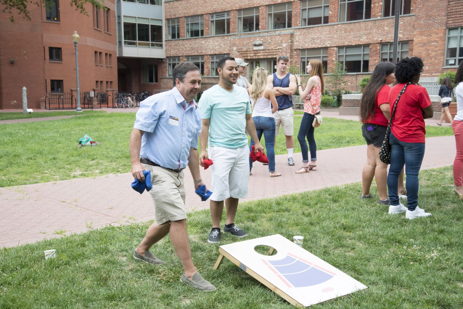 Executive Vice President Steve Slattery plays in the corn-hole tournament at the student and alumni BBQ.