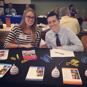 TFAS Campus Recruiter Kendrick Lewis (IPVS 14), pictured left, tables a career fair with fellow TFAS alumnus Bridget Schaaff (ICPES 14), pictured right.