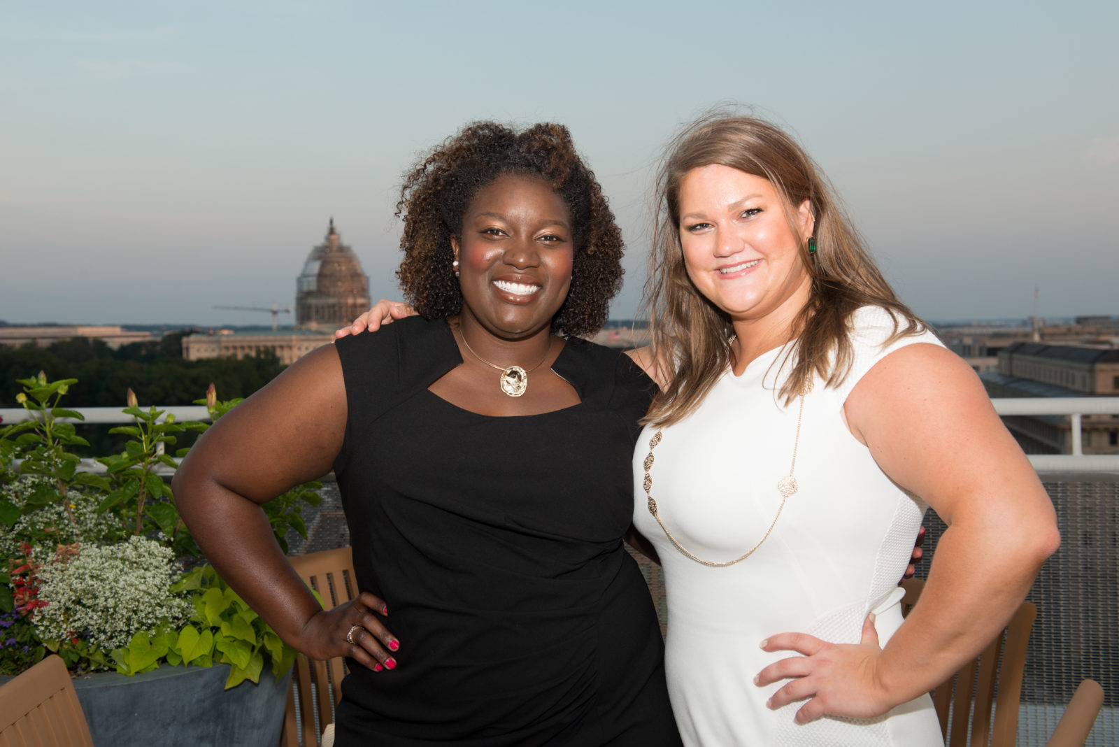 New LSI graduates Akua Amaning (LSI 15) and Amanda Klopf (LSI 15) enjoy the view from their post-graduation ceremony rooftop reception.
