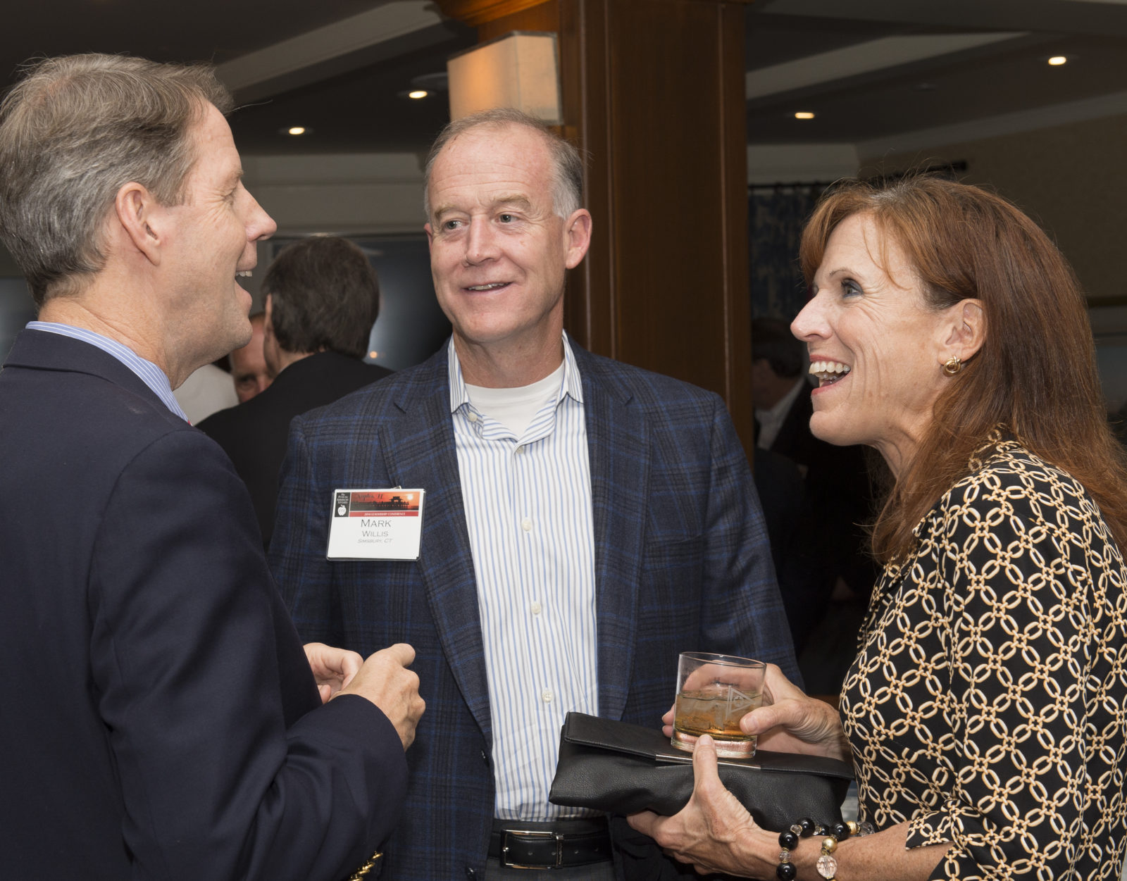 Mark and Patty speak with TFAS President Roger Ream (far left) at the 2014 Leadership Conference in Naples, Florida.