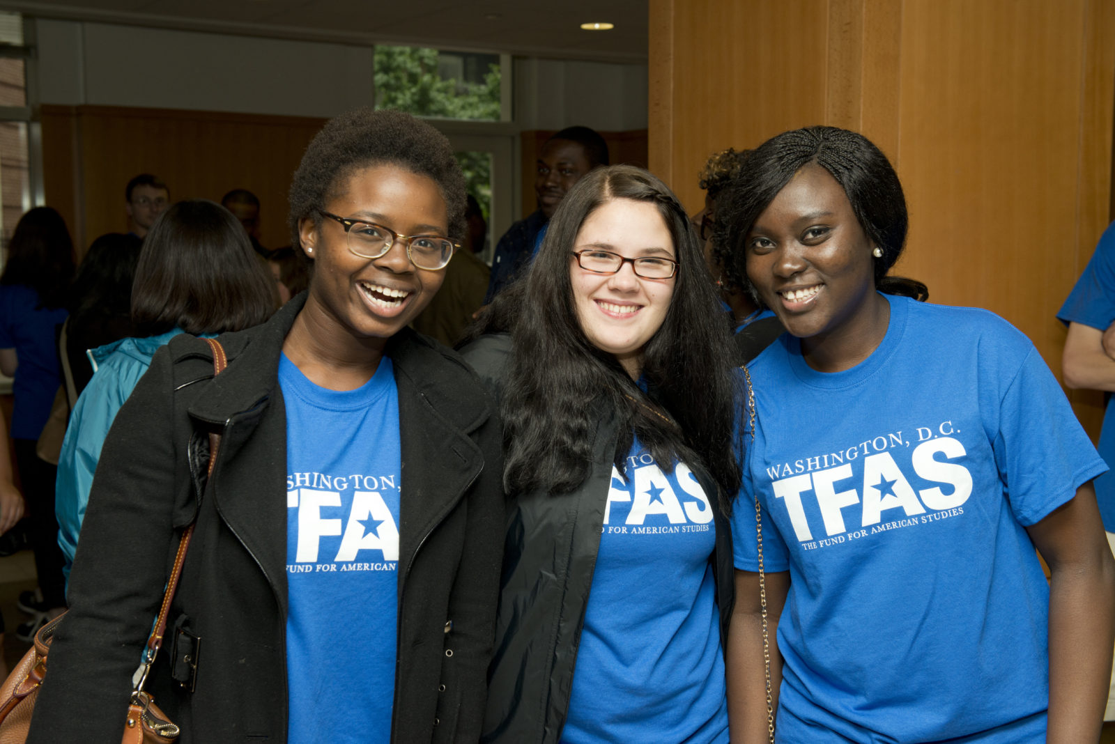 Mercy Anguah (IEIA 13) (right) smiles with her new friends before the monument tour on her first day at TFAS.