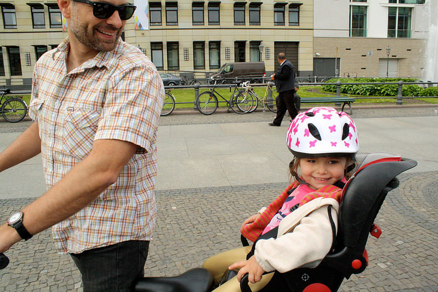 Glader and his daughter Cate bike ride through the streets of Berlin earlier this year.