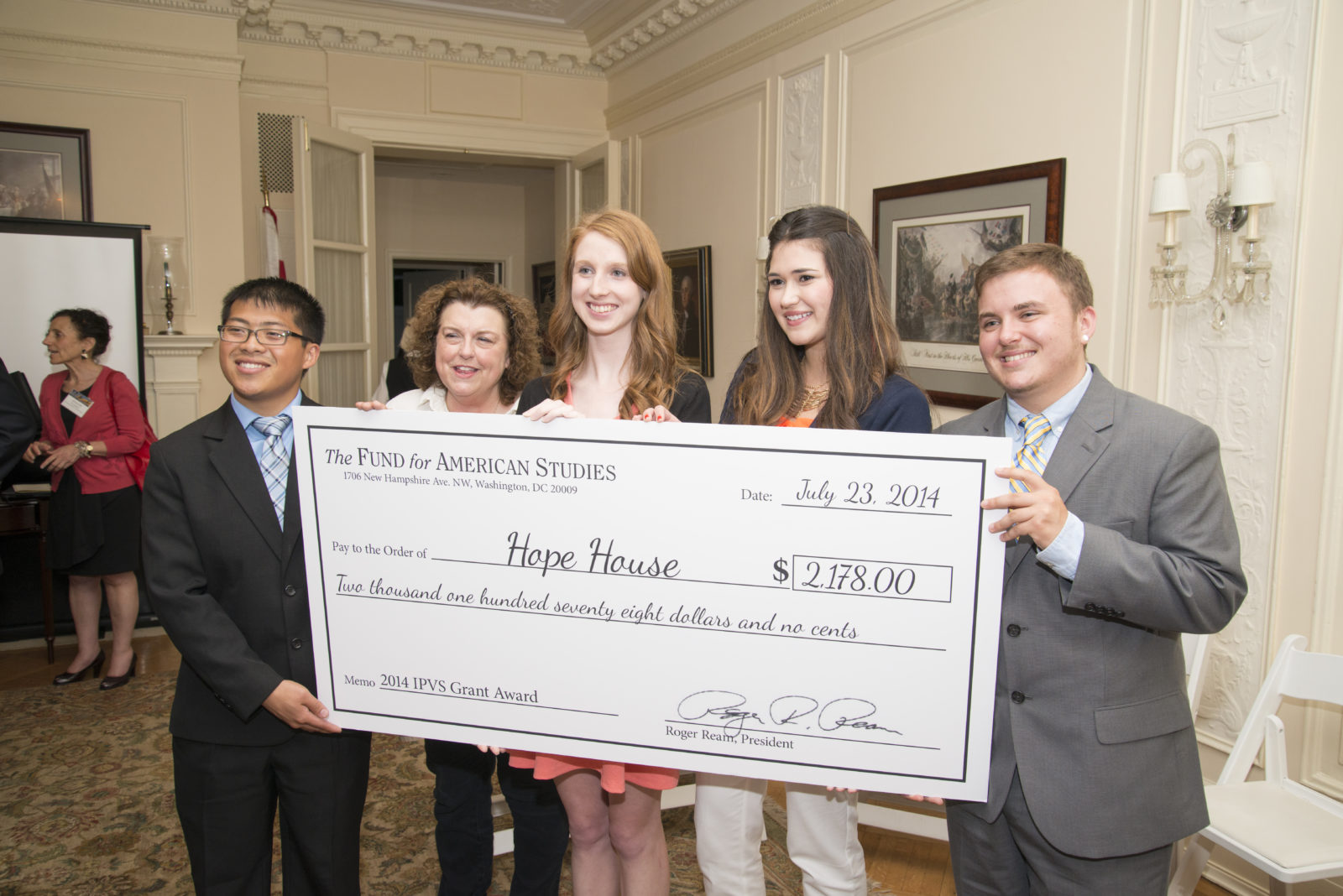 TFAS students from the Institute on Philanthropy and Voluntary Service present a grant to D.C. nonprofit Hope House. During the summer, students raised funds for the grant, reviewed applications from local nonprofits and selected Hope House as the 2014 grantee. 