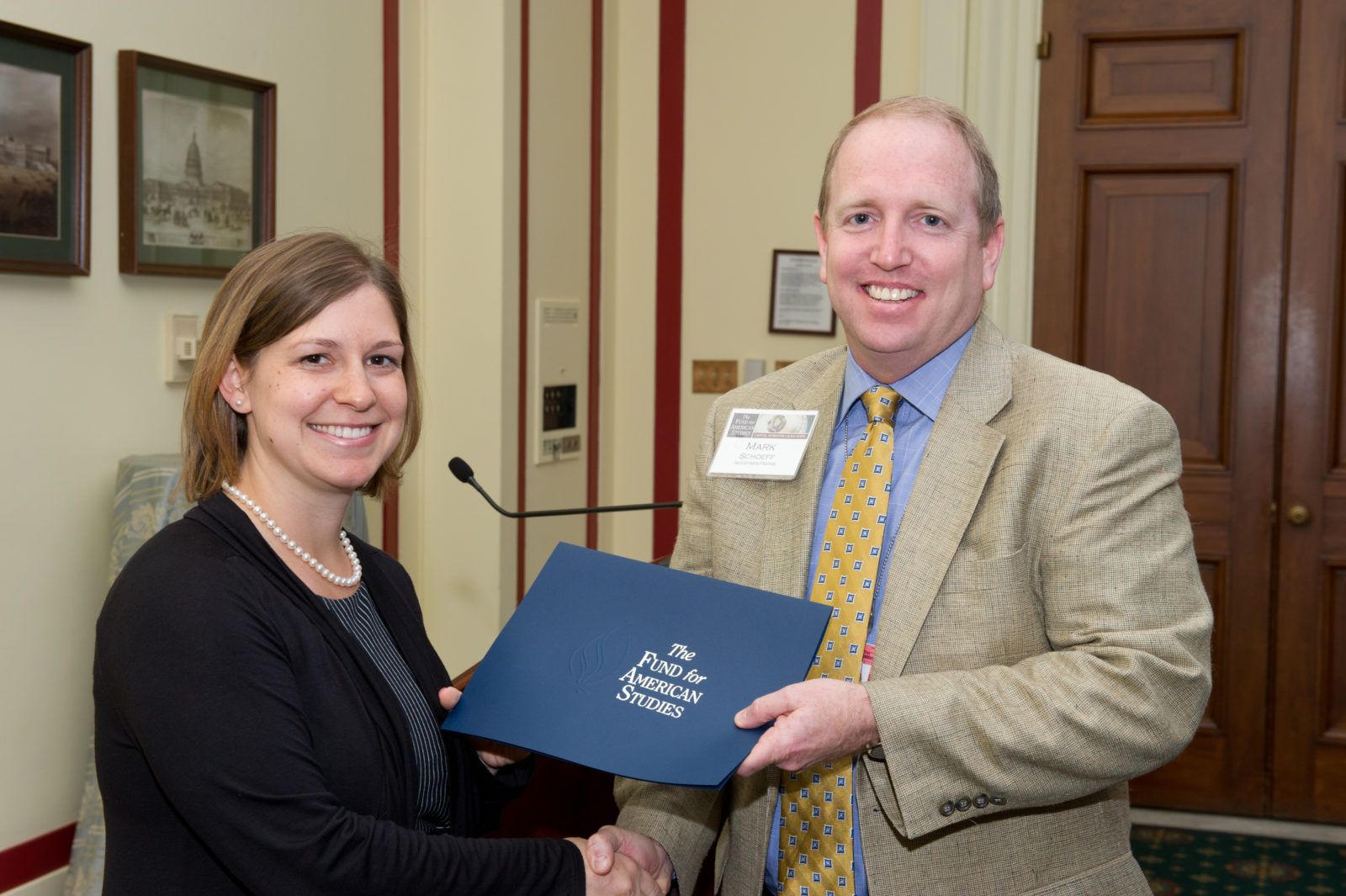Capital Semester Director Lily Harrison presents IPJ Alumnus Mark A. Schoeff (J 89) with the Spring 2012 Outstanding Mentor Award