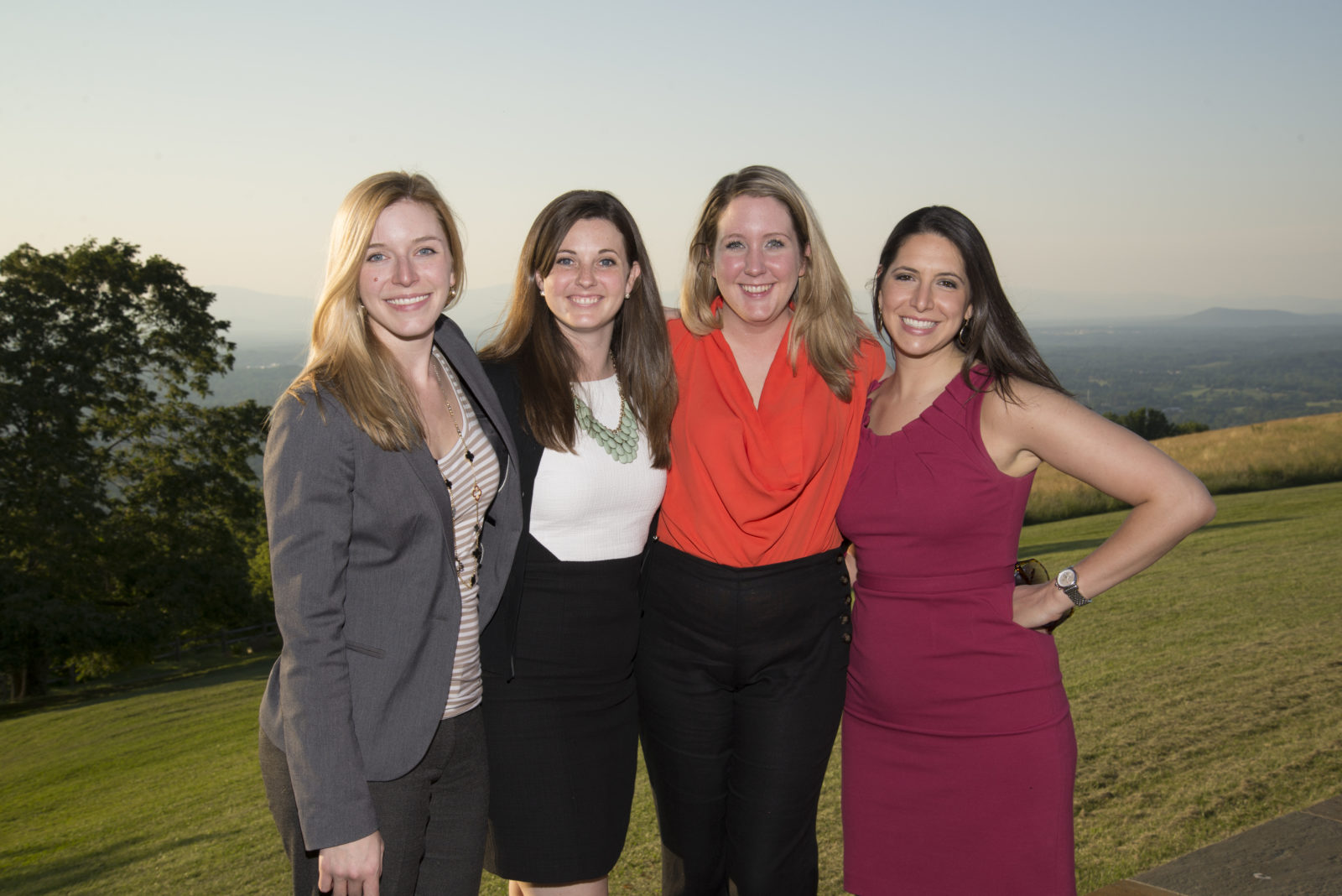 Alumni (l.-r.) Betsy Bryant (IBGA 05), Lindsey Parke (IBGA 05), Cecily Hastings (ICPES 05) and Courtney Rohrbach (IPVS 05) enjoy the view from Thomas Jefferson's Montalto during the annual conference. 