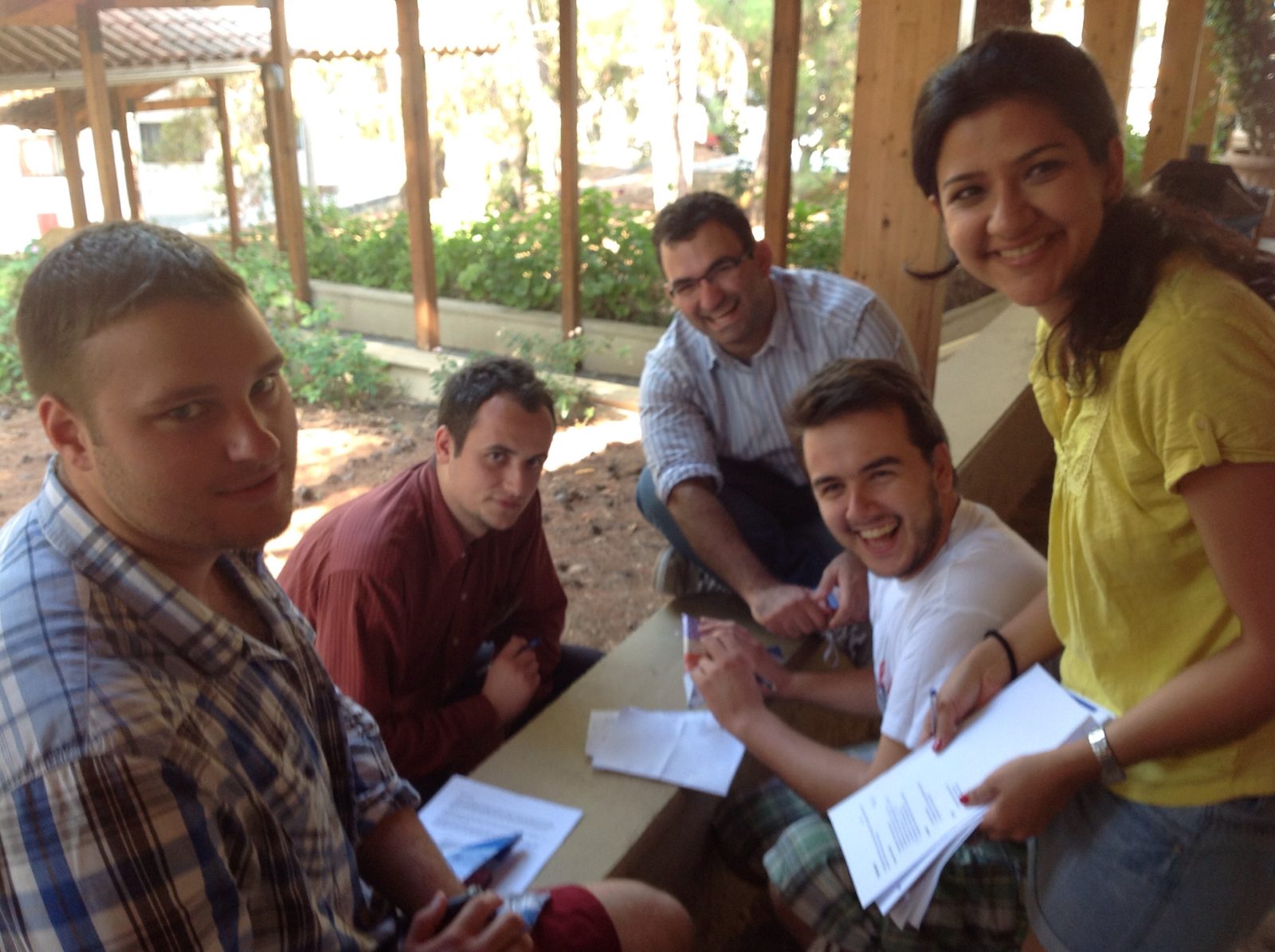 IIPES students (l.-r.) Iulian Popa, Nagib Kasbary, Nikola Djuric and Zeina El-Habre work together during a conflict management simulation. 