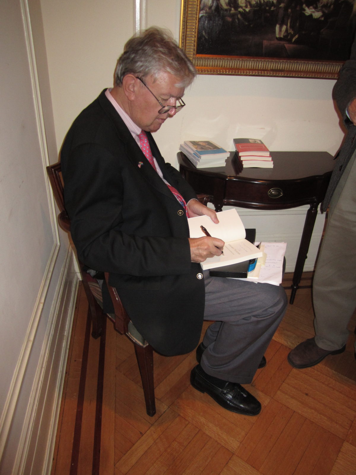 John Blundell signs copies of his book for TFAS students