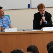 (l.-r.) Ondrej Socuvka (A 01, CSS 04, E 04) and Andrei Postelnicu (A 98, J 99) address the AIPES students during the alumni panel.