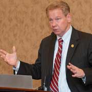 Former Rep. Thomas Davis (Va.) delivers the commencement address to CSF students. 