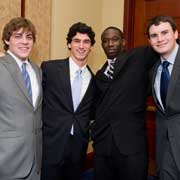 (l.-r.) Capital Semester students Mark Crowley, Steven DeFalco, Ahmadou Drame and Daniel Ley celebrate during the commencement ceremony.