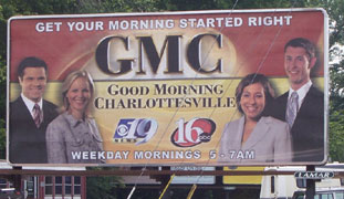 Donatelli (second from right) appears on a billboard with the Good  Morning Charlottesville news team.