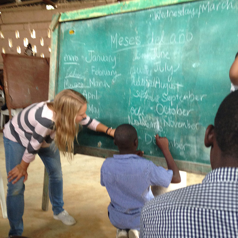 Jace teaches an English lesson to children from Haiti during her study-abroad program in the Dominican Republic.