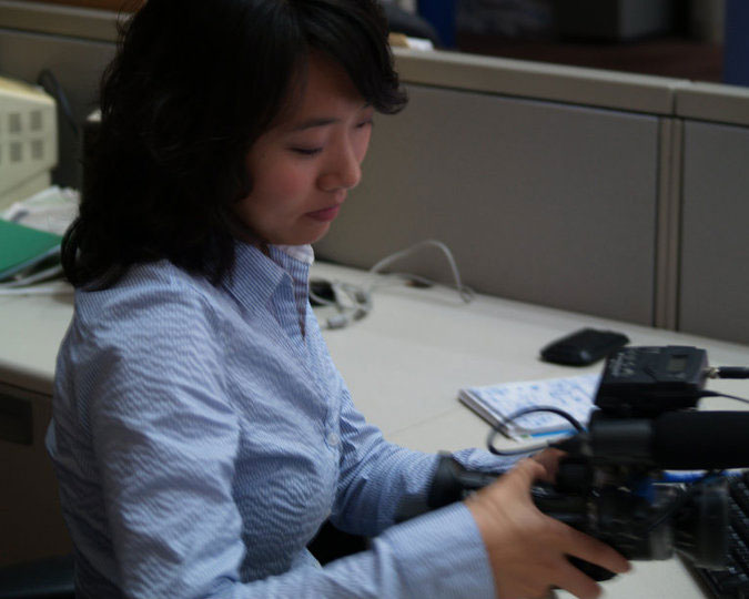 Elizabeth Jia with a camera